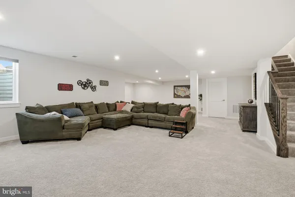 a view of a livingroom with furniture and windows