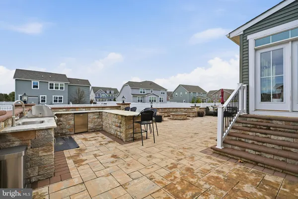 a front view of house with yard and seating area