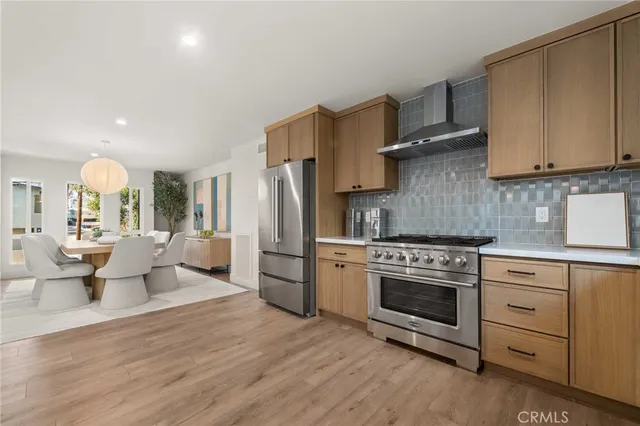 a kitchen with granite countertop a sink and cabinets