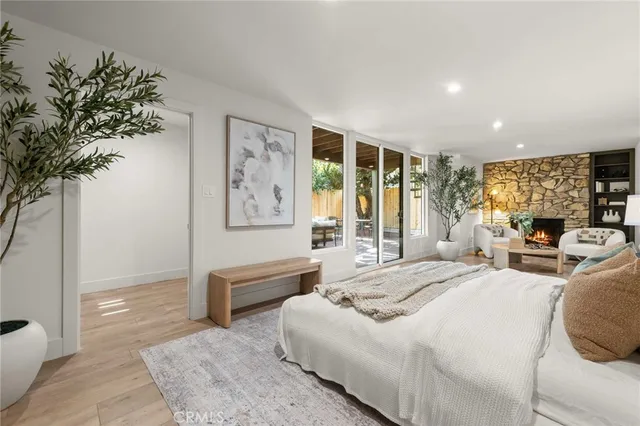 a balcony with wooden floor and glass door
