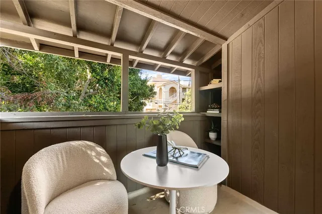 a view of a backyard with table and chairs