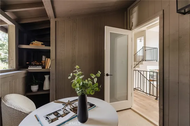 a backyard of a house with barbeque oven table and chairs