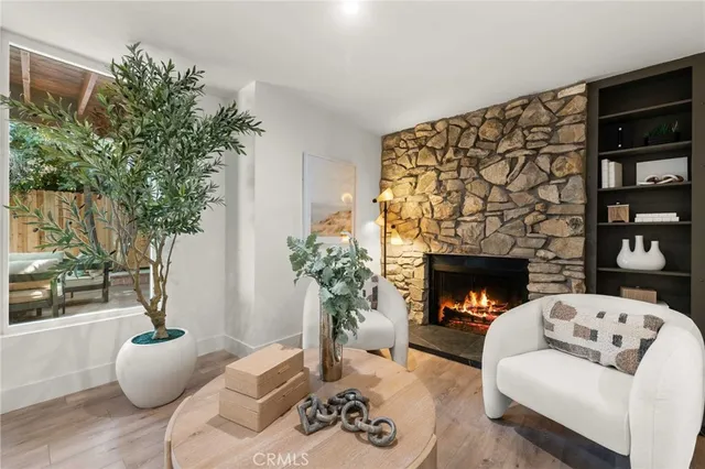 a kitchen with a dining table chairs appliances and cabinets