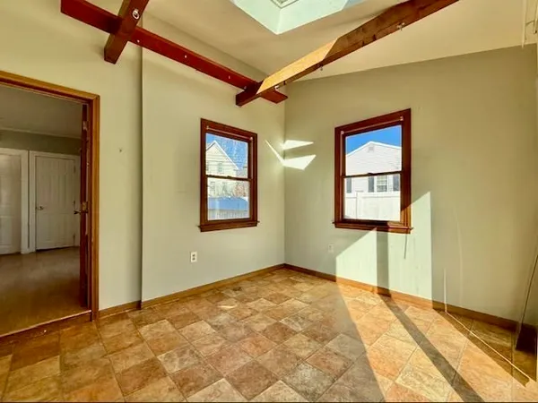 a view of an empty room with a window