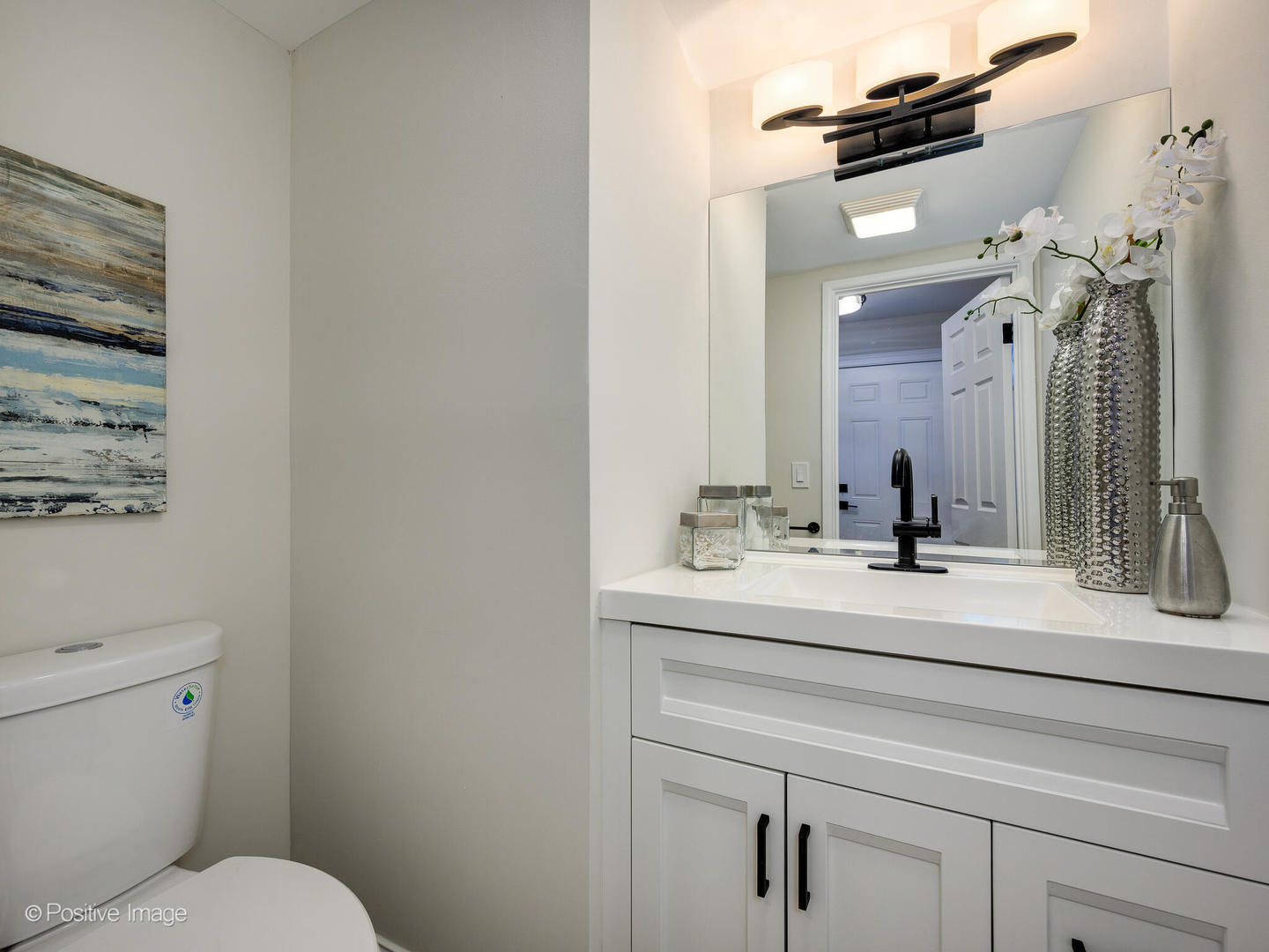 526 Thomas Road Bolingbrook, IL 60440 - Photo 12 of 23 a bathroom with a sink vanity mirror and toilet
