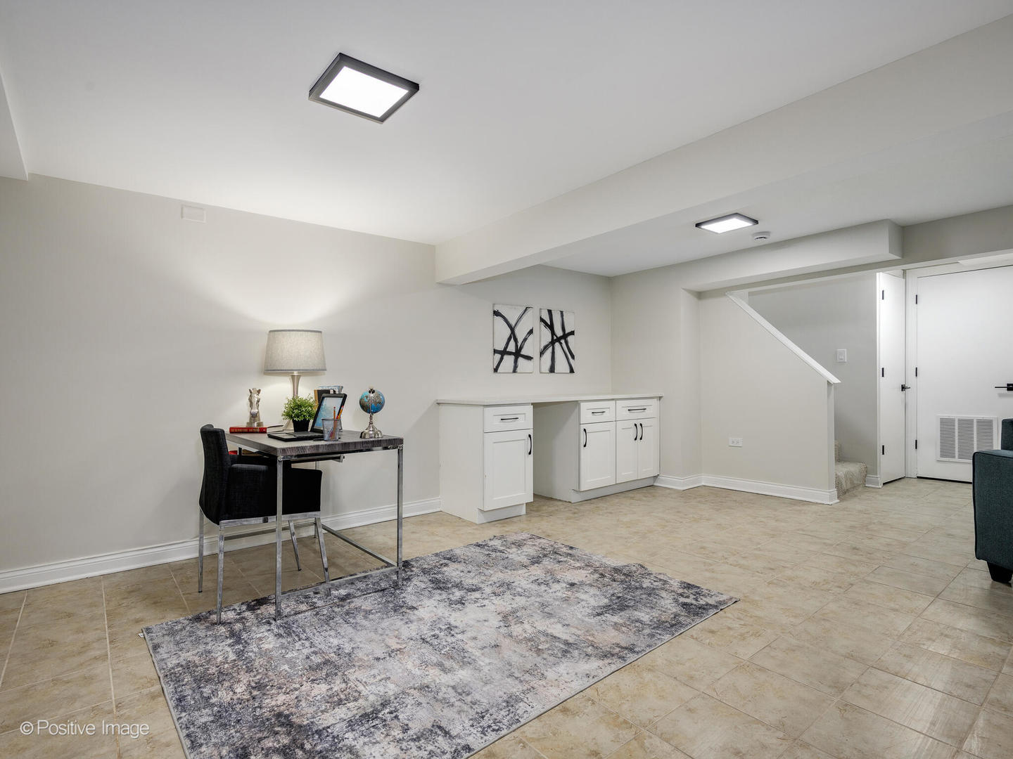 526 Thomas Road Bolingbrook, IL 60440 - Photo 21 of 23 a living room with furniture and a rug
