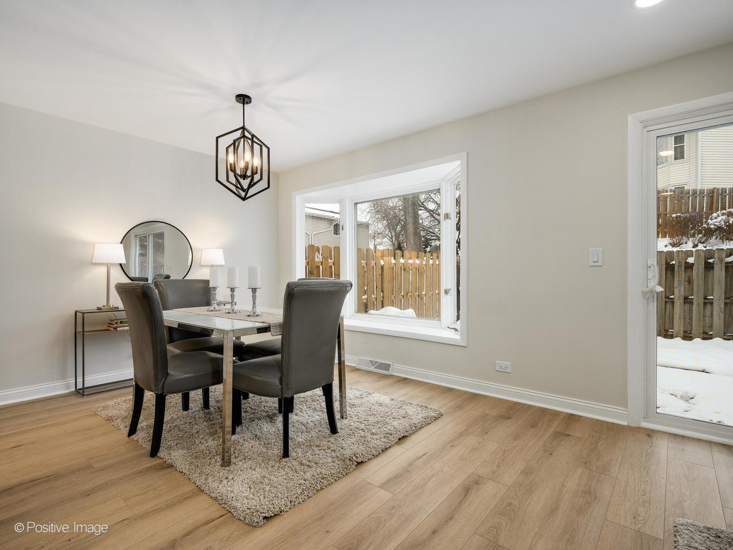 526 Thomas Road Bolingbrook, IL 60440 - Photo 6 of 23 a view of a dining room with furniture window and wooden floor