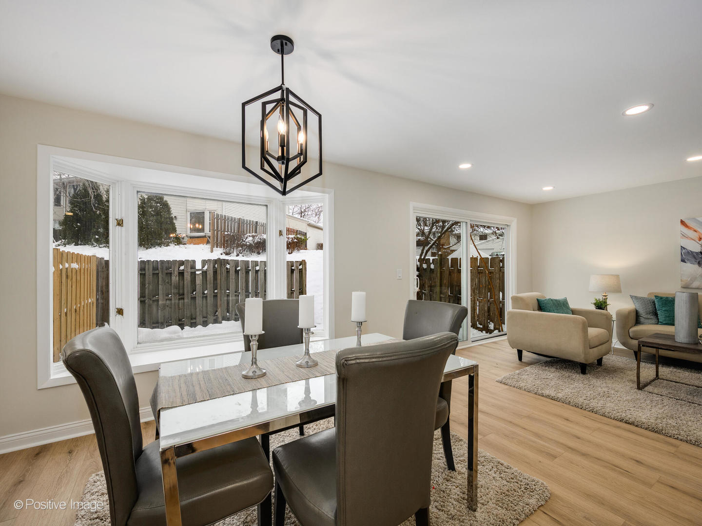 526 Thomas Road Bolingbrook, IL 60440 - Photo 7 of 23 a view of a dining room with furniture wooden floor and chandelier
