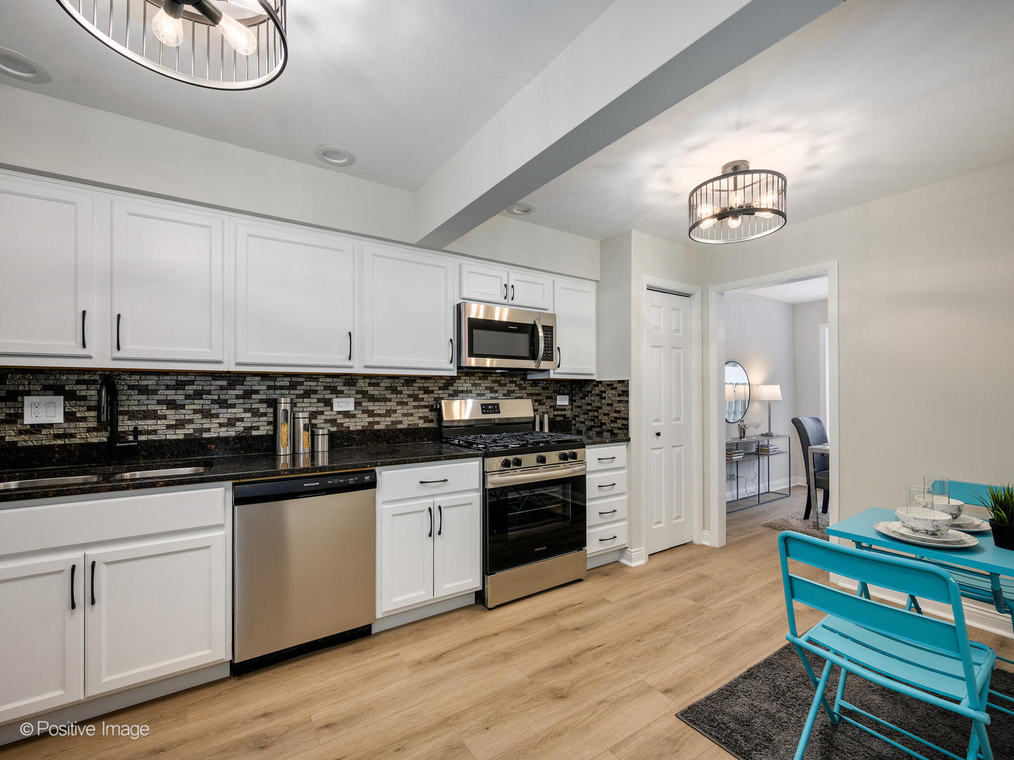 526 Thomas Road Bolingbrook, IL 60440 - Photo 8 of 23 a kitchen with granite countertop stainless steel appliances a stove microwave and sink