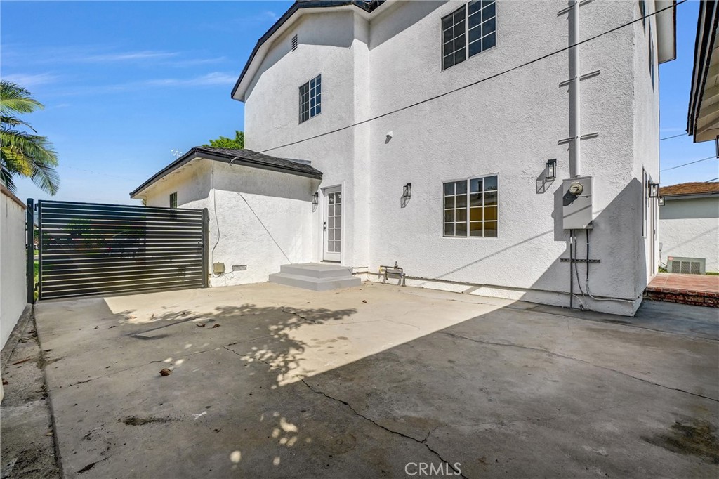 1200 South Castlegate Avenue Compton, CA 90221 - Photo 37 of 39 a view of a house with a yard