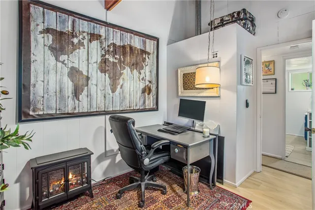 a view of a livingroom with furniture and a window