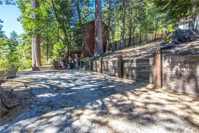 a view of a house with a tree in the background