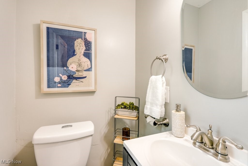 2340 Canterbury Road University Heights, OH 44118 - Photo 16 of 29 Half bath with vanity and toilet