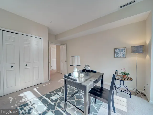 a workspace with furniture and rug