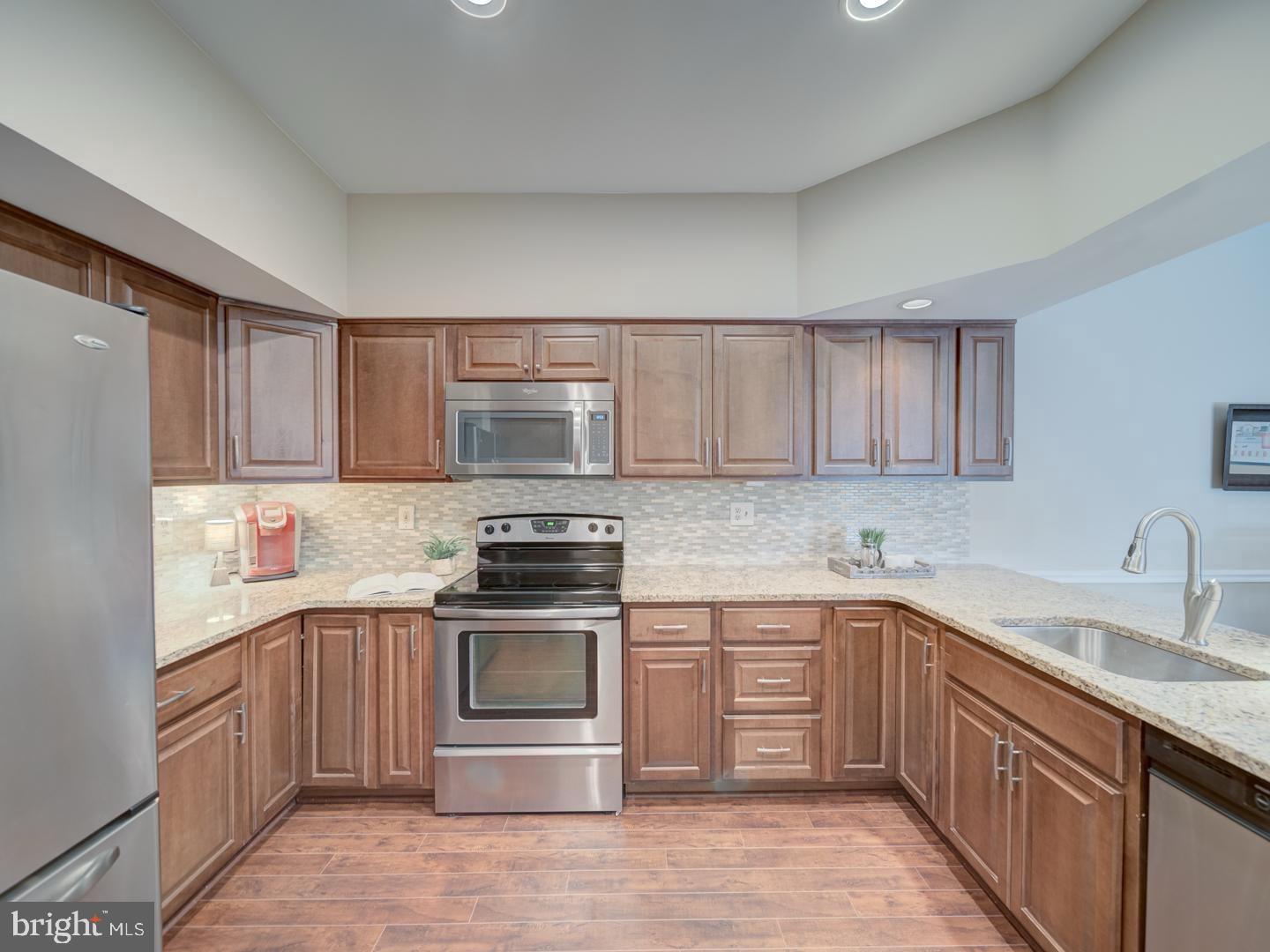 2708 Summerview Way Annapolis, MD 21401 - Photo 9 of 24 Modern kitchen with sleek finishes.