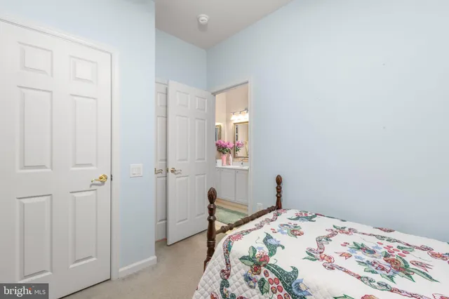 a kitchen with stainless steel appliances granite countertop a sink and a refrigerator