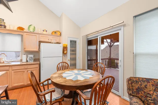 a bedroom with a bed dresser and window