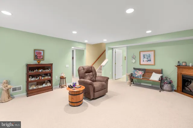 a spacious bedroom with a bed and a chandelier