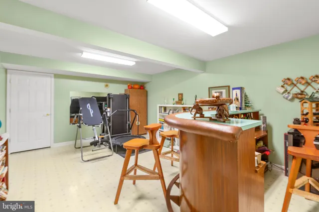a view of a porch with furniture and garden