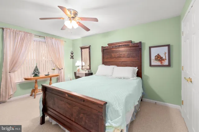 a view of a room with chairs and floor to ceiling window