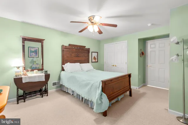 a view of a wooden chairs on the roof deck