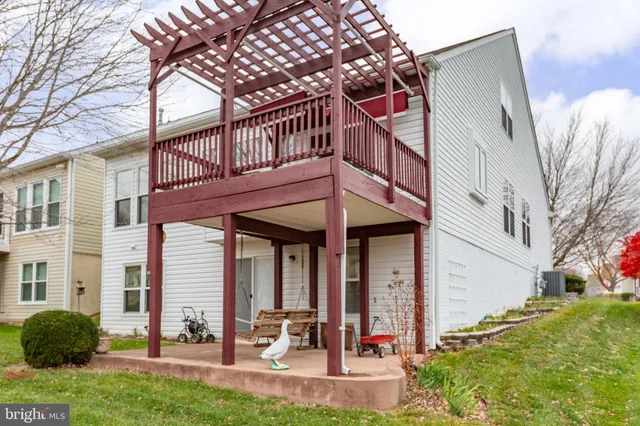 a view of a patio with table and chairs potted plants with wooden floor