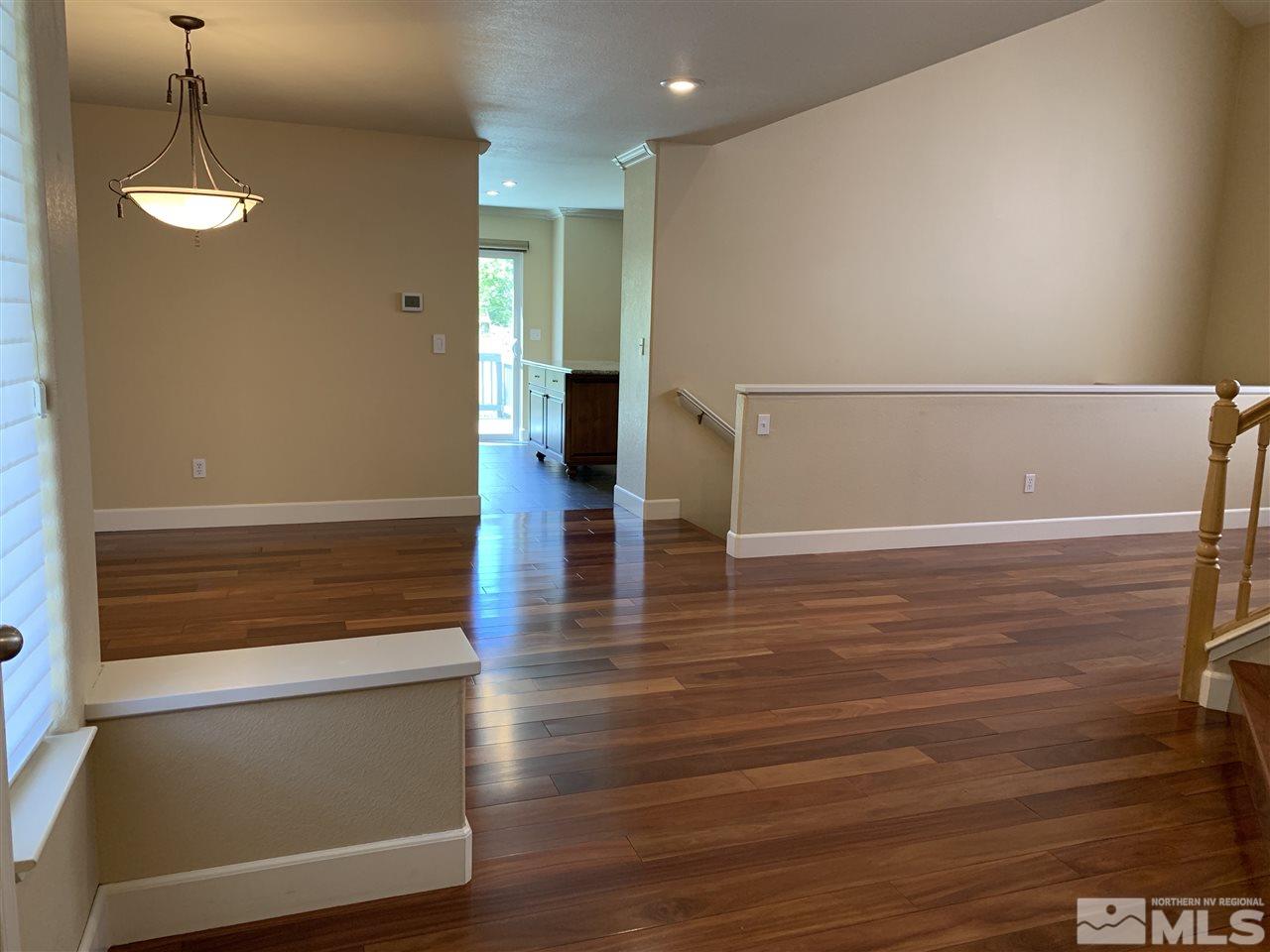 3126 Alpine Creek Road Reno, NV 89519 - Photo 11 of 25 a view of hallway with stairs and wooden floor