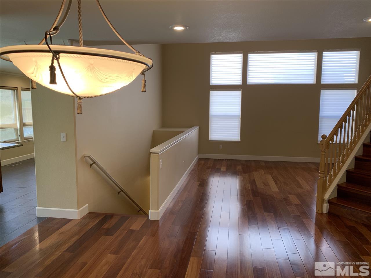 3126 Alpine Creek Road Reno, NV 89519 - Photo 12 of 25 a view of empty room with wooden floor and fan