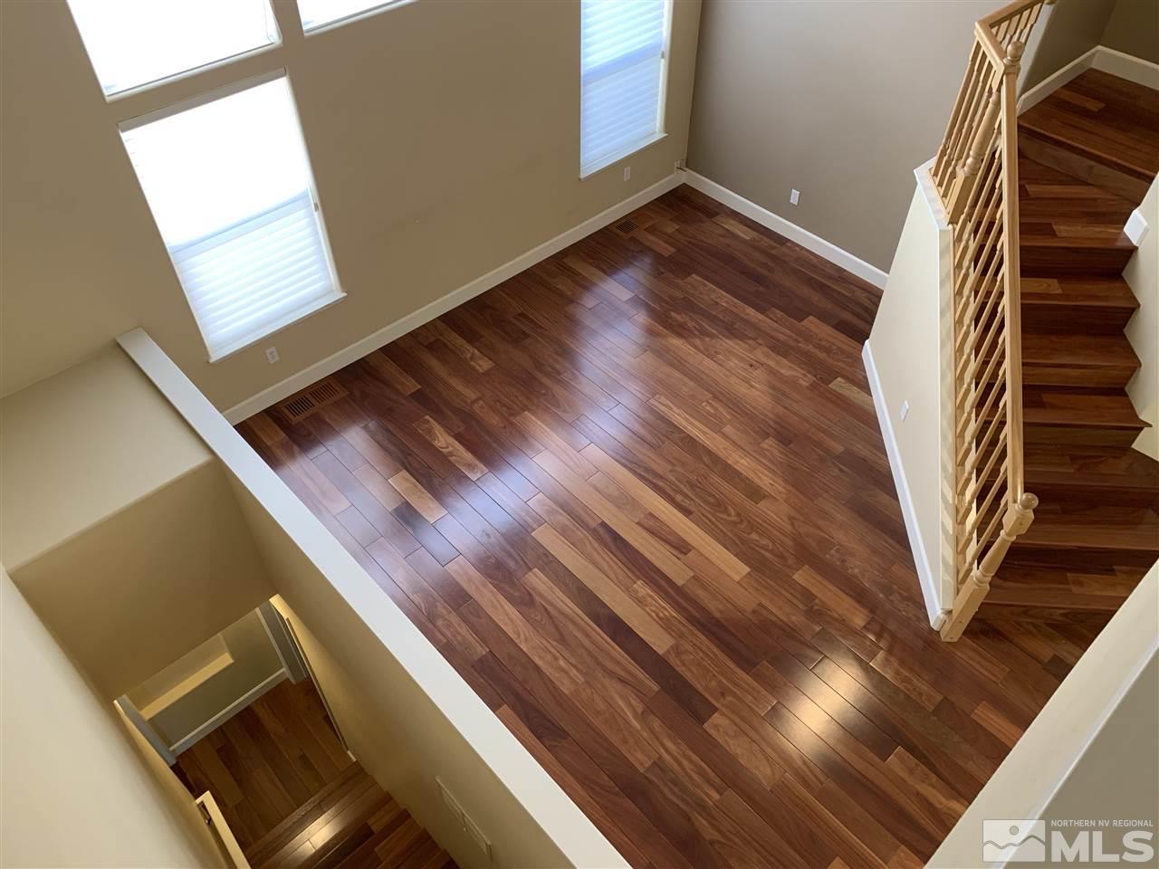 3126 Alpine Creek Road Reno, NV 89519 - Photo 17 of 25 a view of an empty room with wooden floor