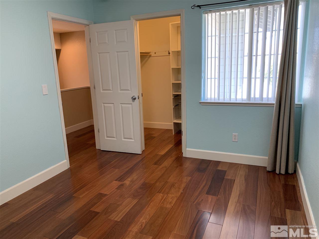 3126 Alpine Creek Road Reno, NV 89519 - Photo 18 of 25 an empty room with wooden floor and windows