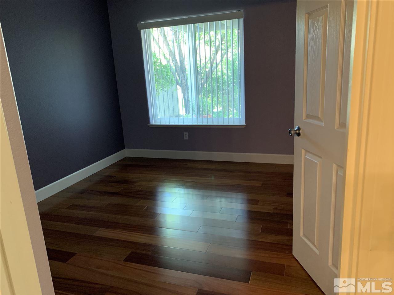 3126 Alpine Creek Road Reno, NV 89519 - Photo 19 of 25 a view of empty room with wooden floor and fan