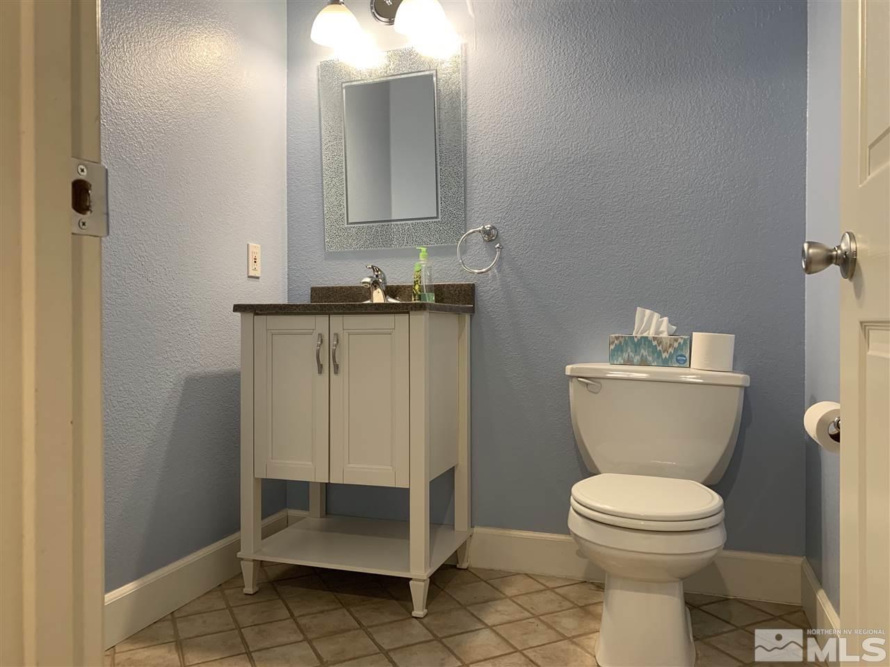3126 Alpine Creek Road Reno, NV 89519 - Photo 21 of 25 a bathroom with a sink toilet and a mirror