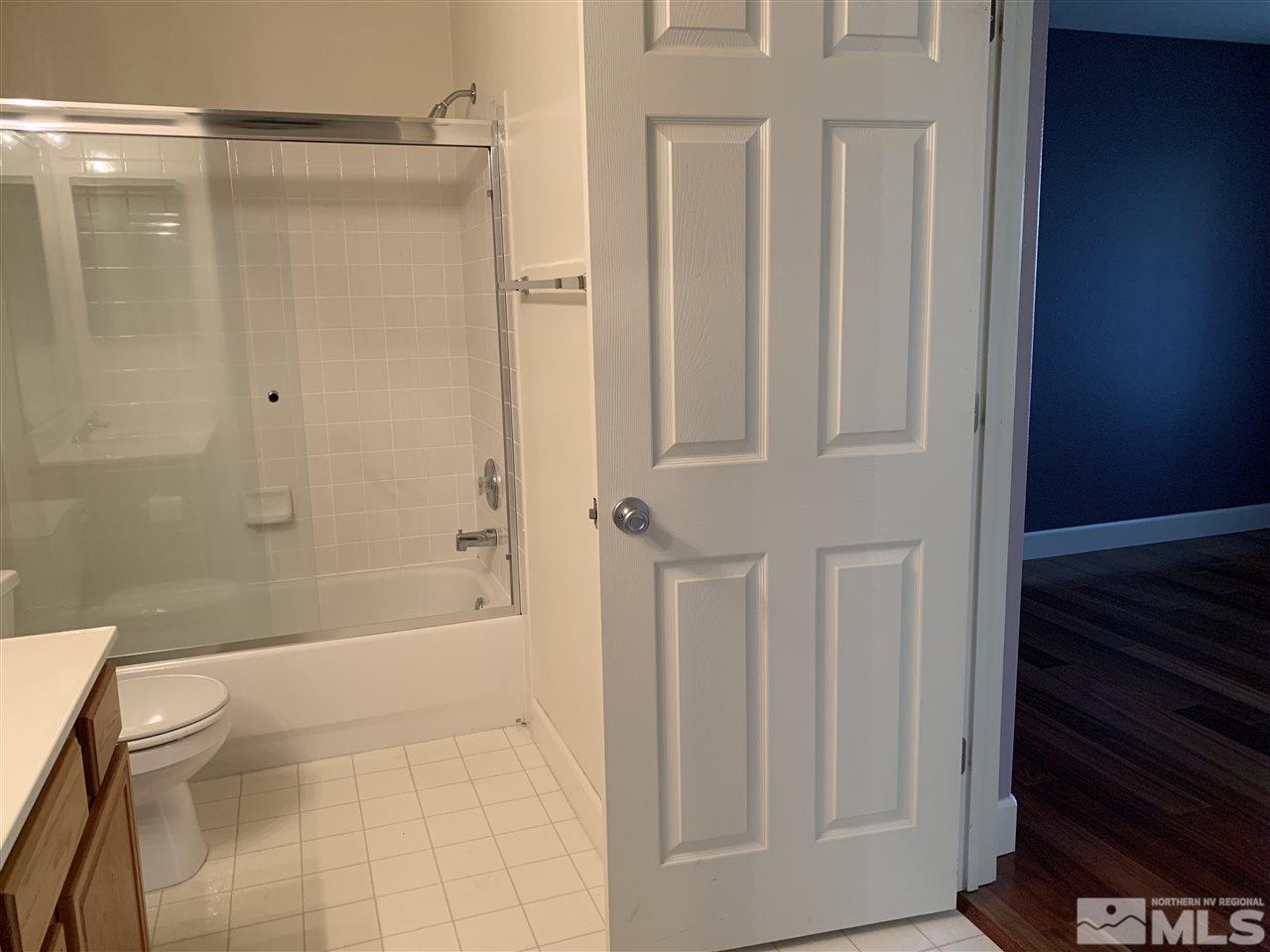 3126 Alpine Creek Road Reno, NV 89519 - Photo 22 of 25 a bathroom with a shower and a toilet