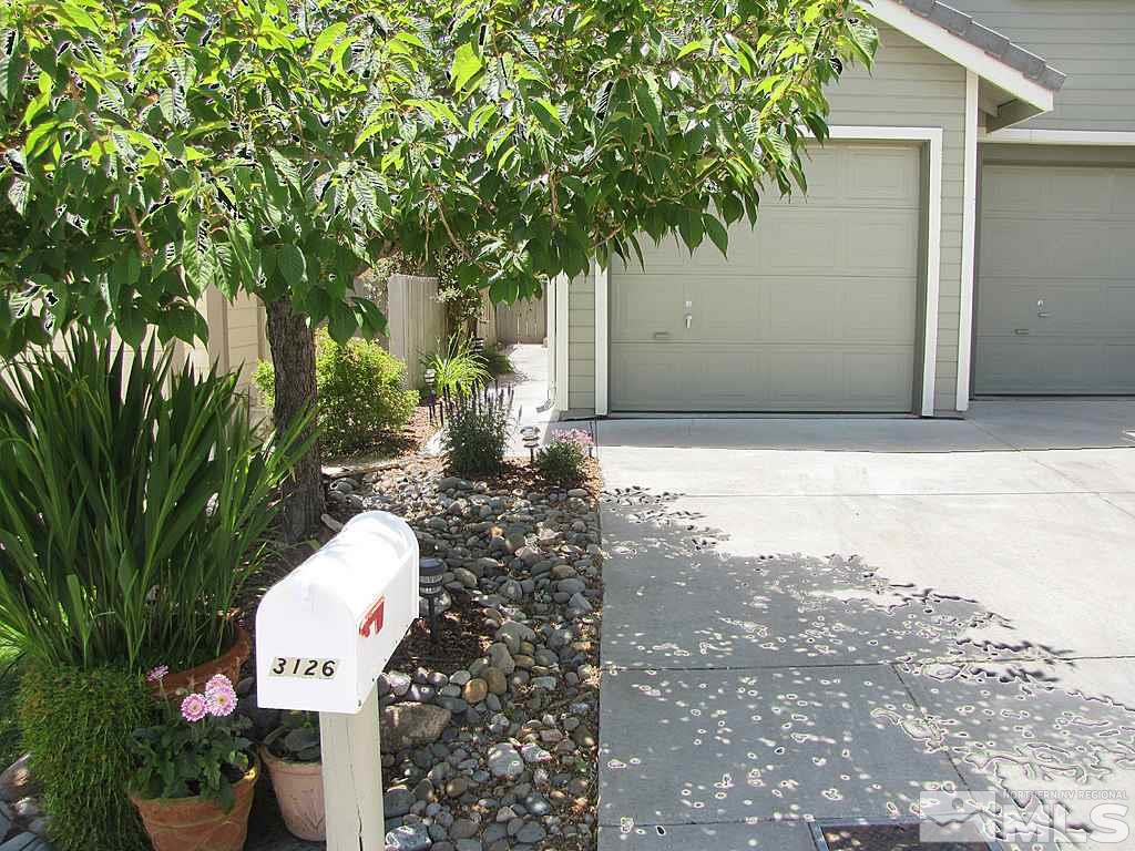 3126 Alpine Creek Road Reno, NV 89519 - Photo 3 of 25 a front view of a house with a yard and tree s