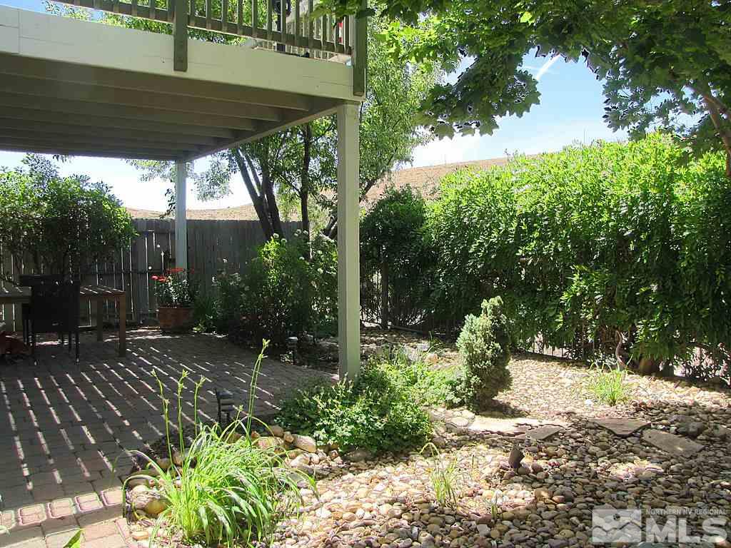 3126 Alpine Creek Road Reno, NV 89519 - Photo 6 of 25 a view of backyard with plants and trees