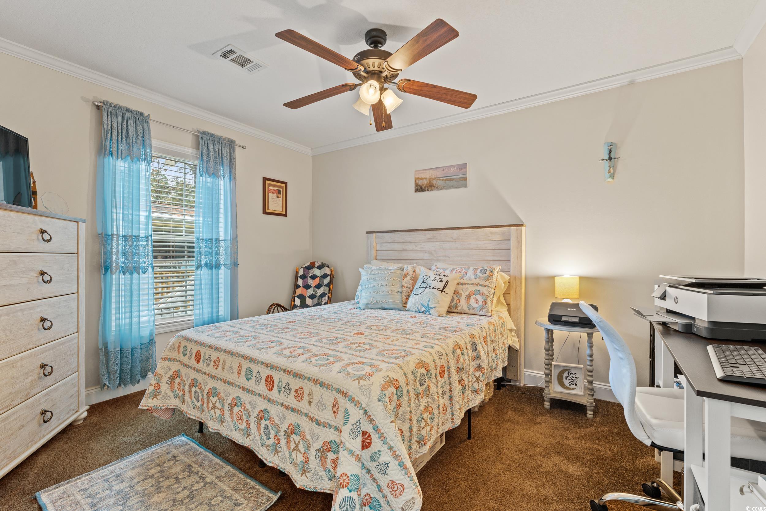 90 Offshore Drive Murrells Inlet, SC 29576 - Photo 18 of 40 Bedroom featuring crown molding, dark carpet, a ceiling fan, and an office area
