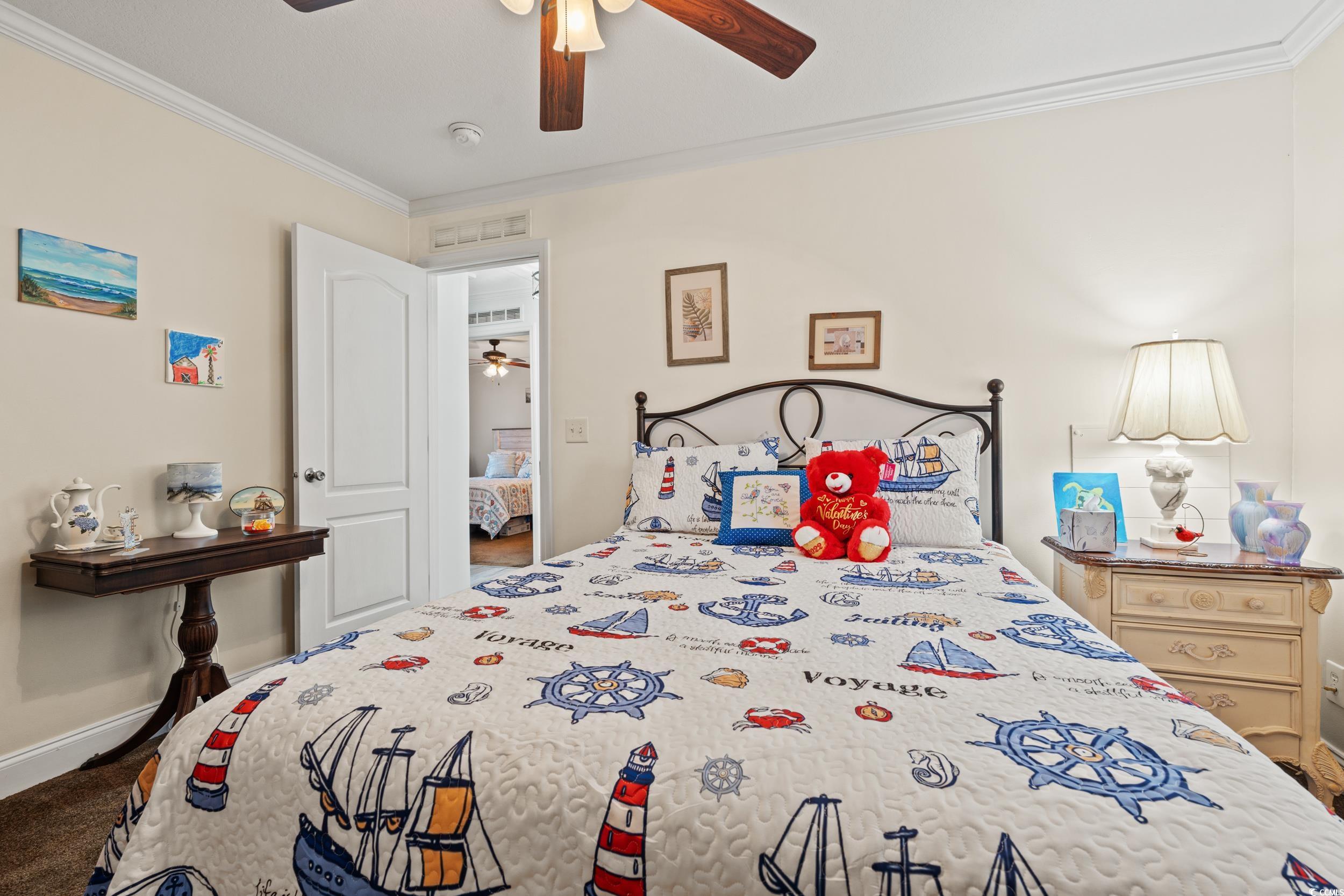 90 Offshore Drive Murrells Inlet, SC 29576 - Photo 20 of 40 Bedroom with ornamental molding, ceiling fan, and carpet flooring