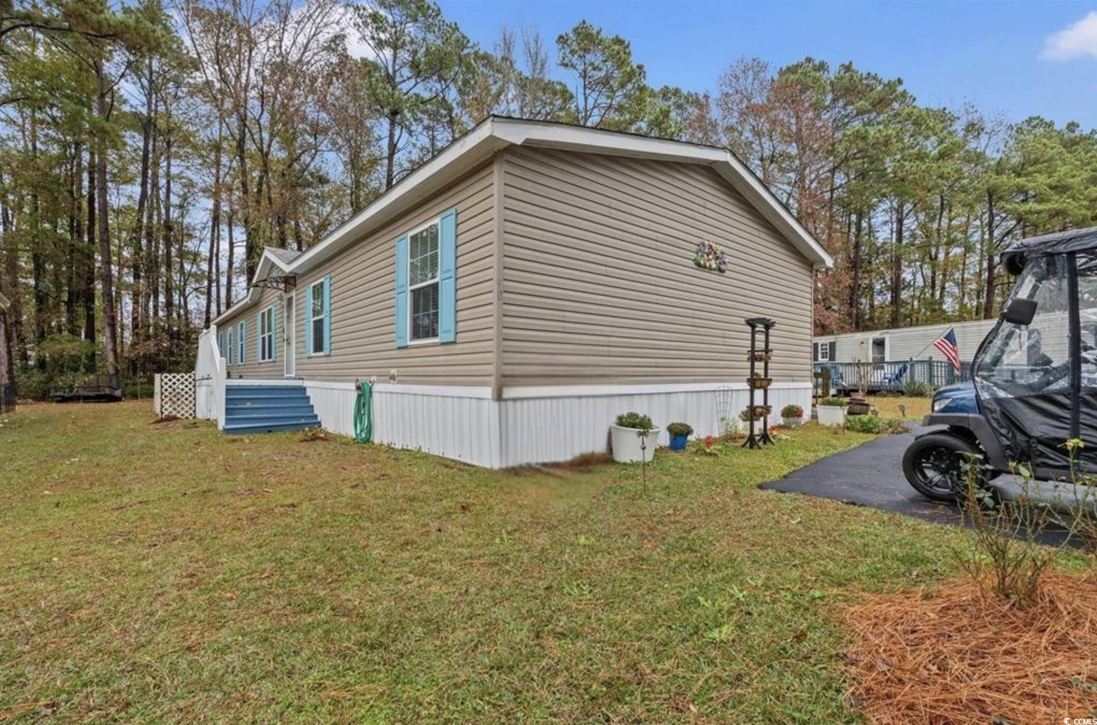 90 Offshore Drive Murrells Inlet, SC 29576 - Photo 30 of 40 View of home's exterior with a yard