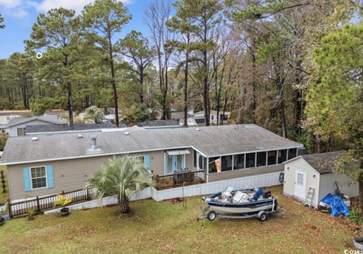 90 Offshore Drive Murrells Inlet, SC 29576 - Photo 36 of 40 Rear view of property with a sunroom, a shed, and a yard