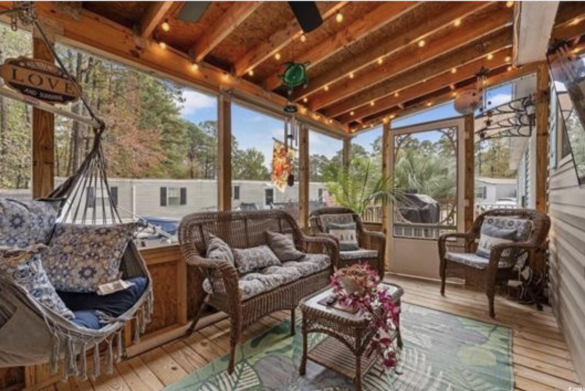 90 Offshore Drive Murrells Inlet, SC 29576 - Photo 4 of 40 Sunroom / solarium featuring outdoor lounge area, vaulted ceiling, a wooden deck, and ceiling fan