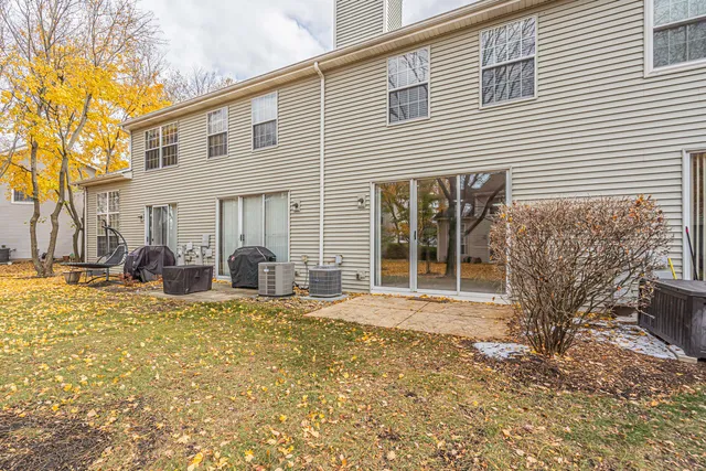 a view of a house with backyard porch and furniture