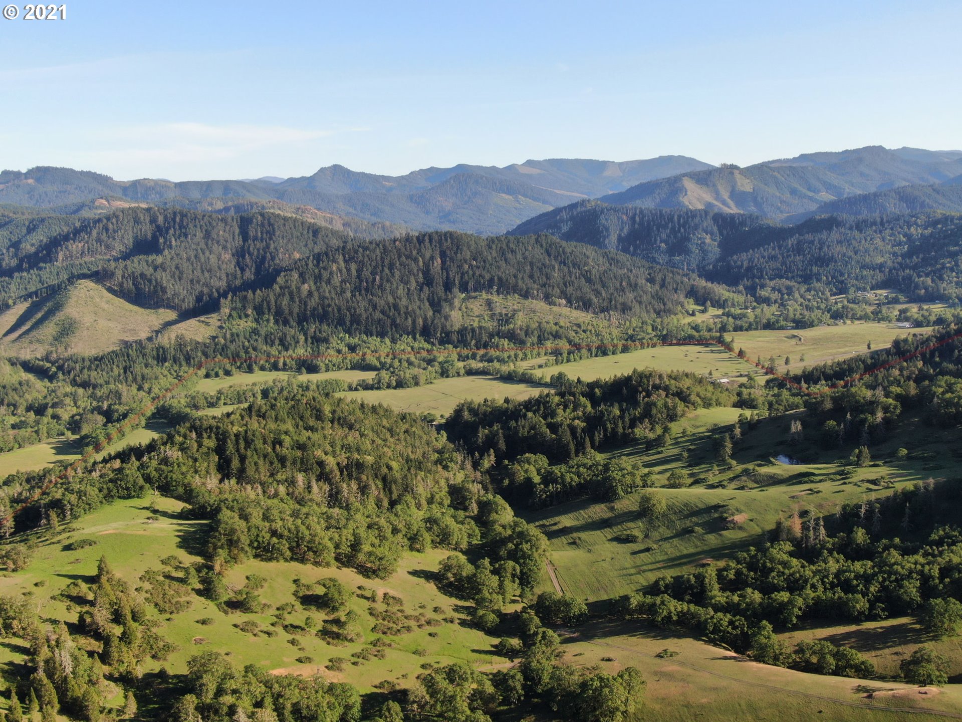 4189 Upper Olalla Road Winston, OR 97496 - Photo 29 of 32 a view of a lush green hillside and houses
