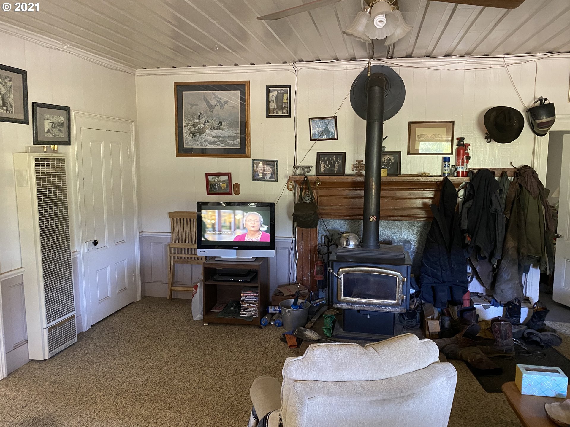 4189 Upper Olalla Road Winston, OR 97496 - Photo 30 of 32 a living room with furniture and a fireplace