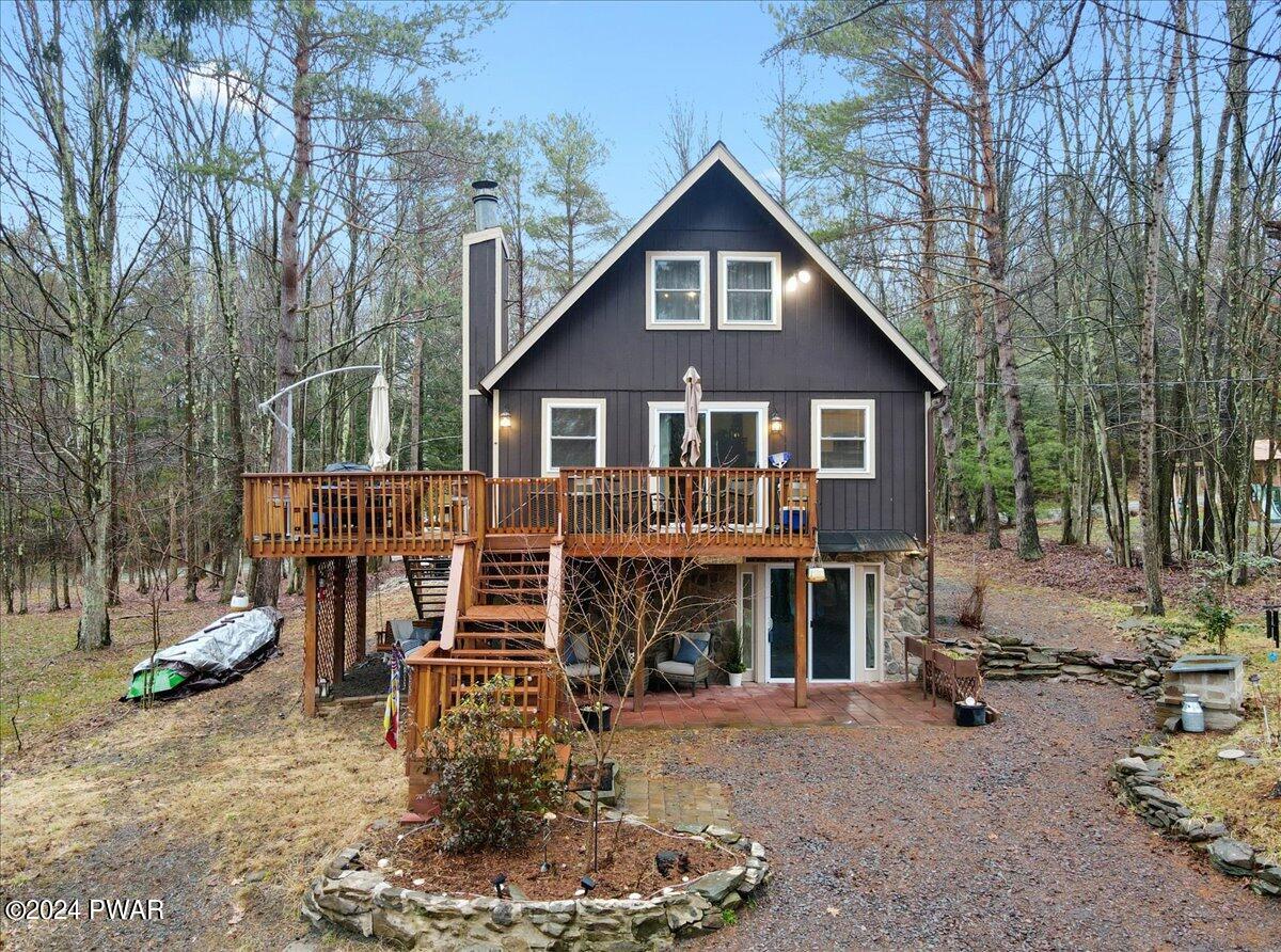 8 Crest View Road Lake Ariel, PA 18436 - Photo 16 of 44 a view of a house with a yard patio and fire pit