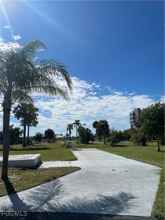 a view of a playground with basketball court