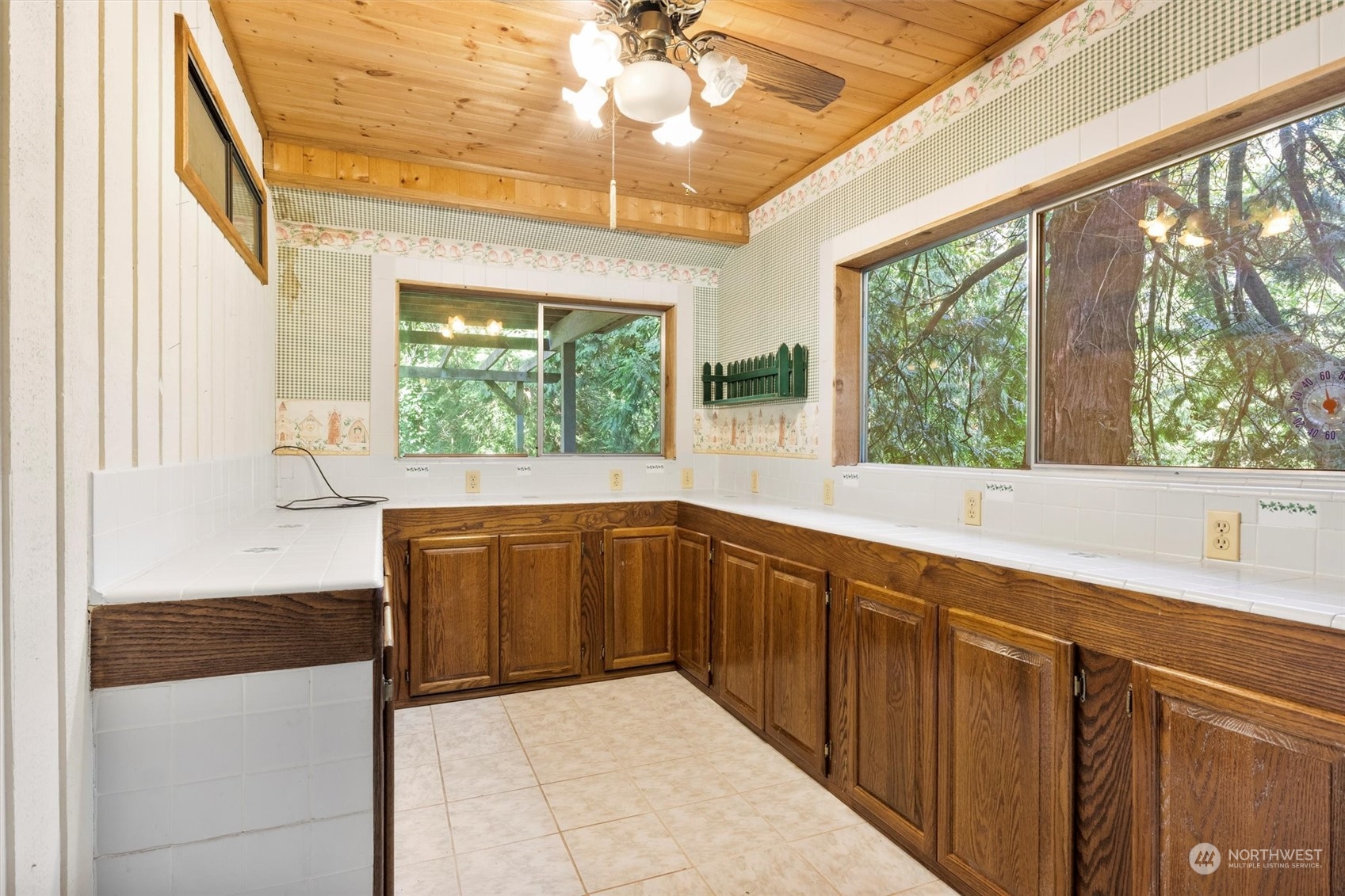 5570 Starry Road Bellingham, WA 98226 - Photo 18 of 34 a kitchen with wooden cabinets and a large window
