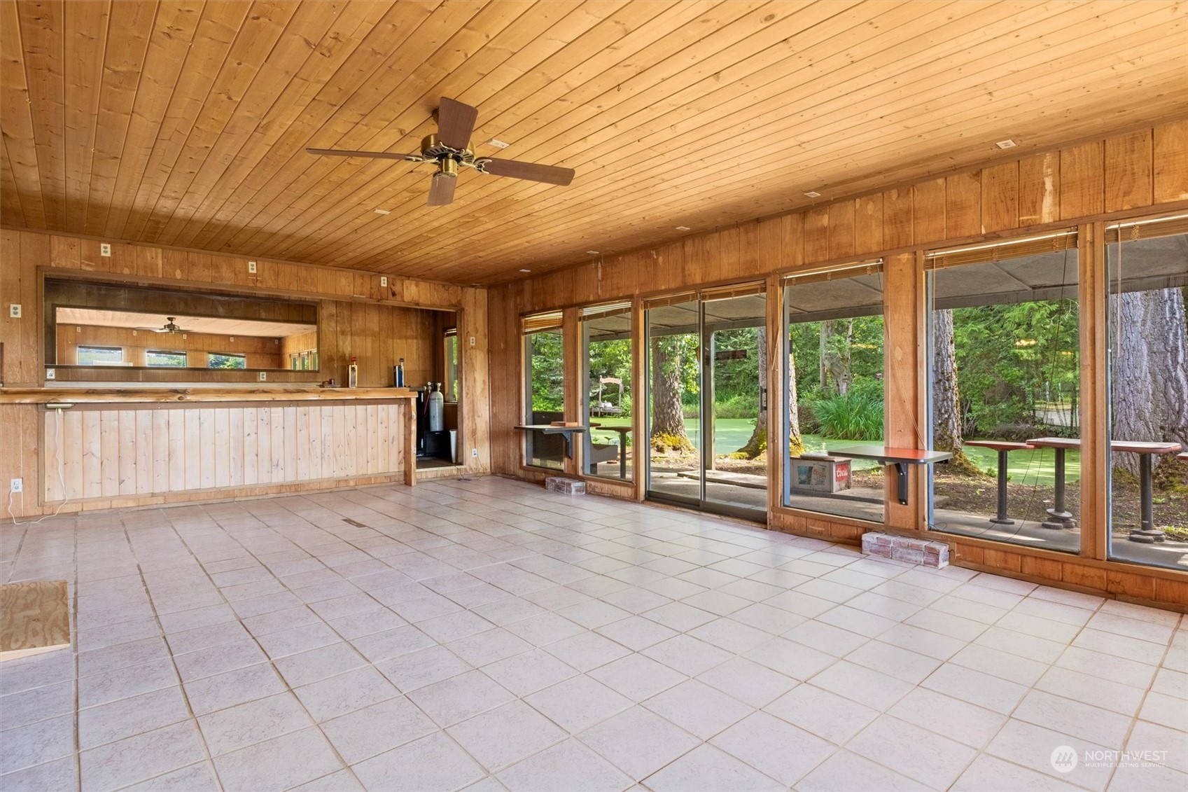 5570 Starry Road Bellingham, WA 98226 - Photo 30 of 34 a large room with wooden floor and brick walls