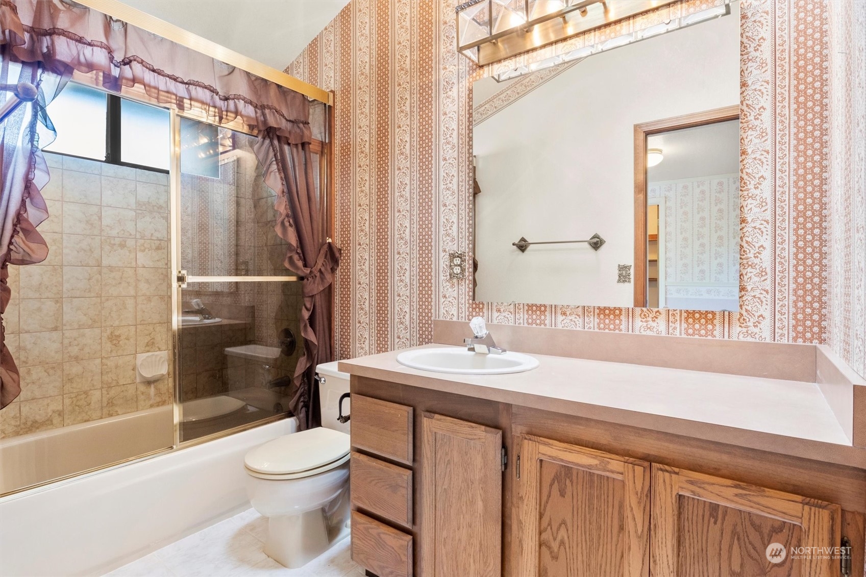 5570 Starry Road Bellingham, WA 98226 - Photo 10 of 34 a bathroom with a sink a toilet a mirror and bathtub
