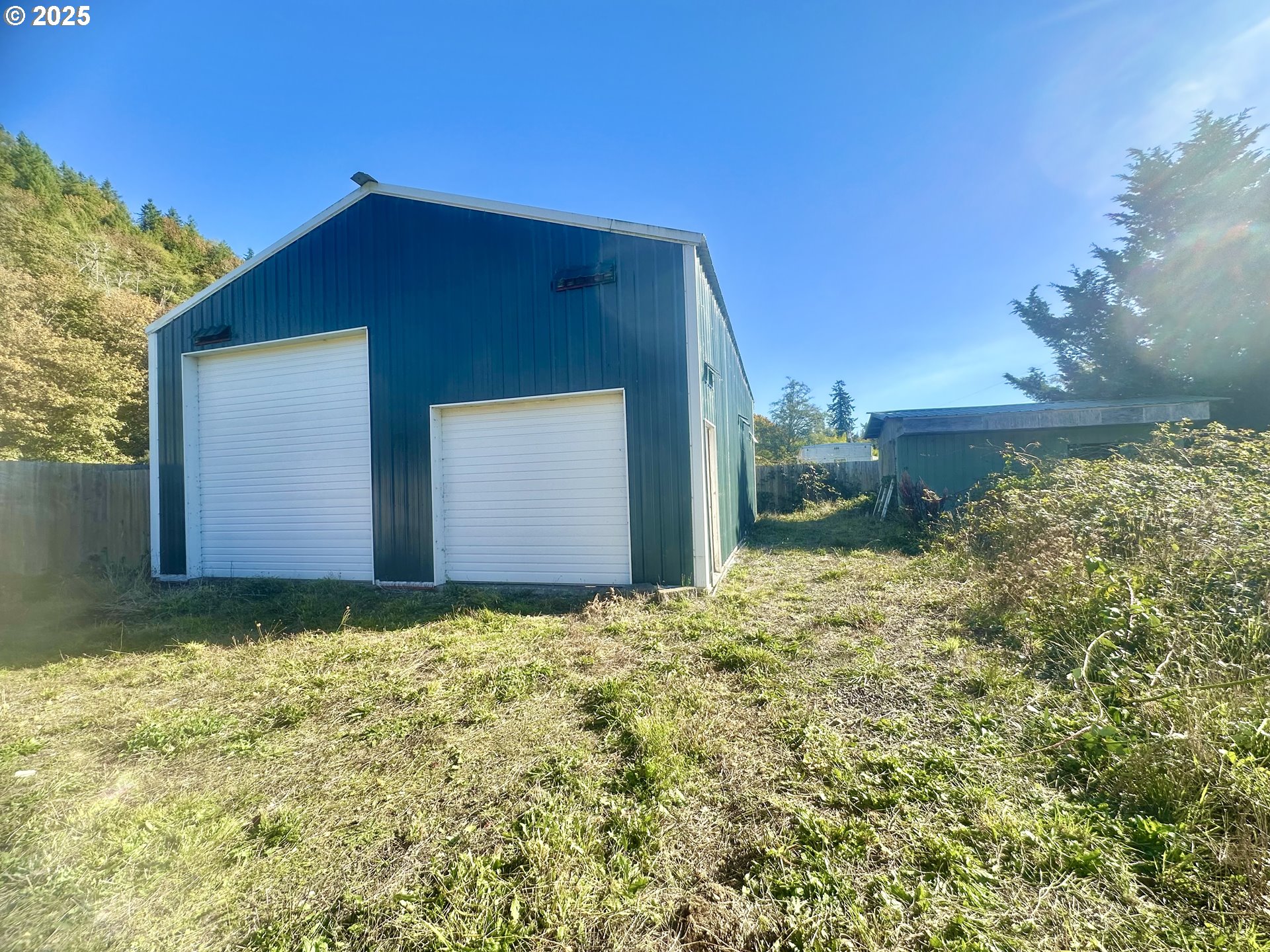 24275 Bunn Creek Road Cloverdale, OR 97112 - Photo 25 of 32 a backyard of a house