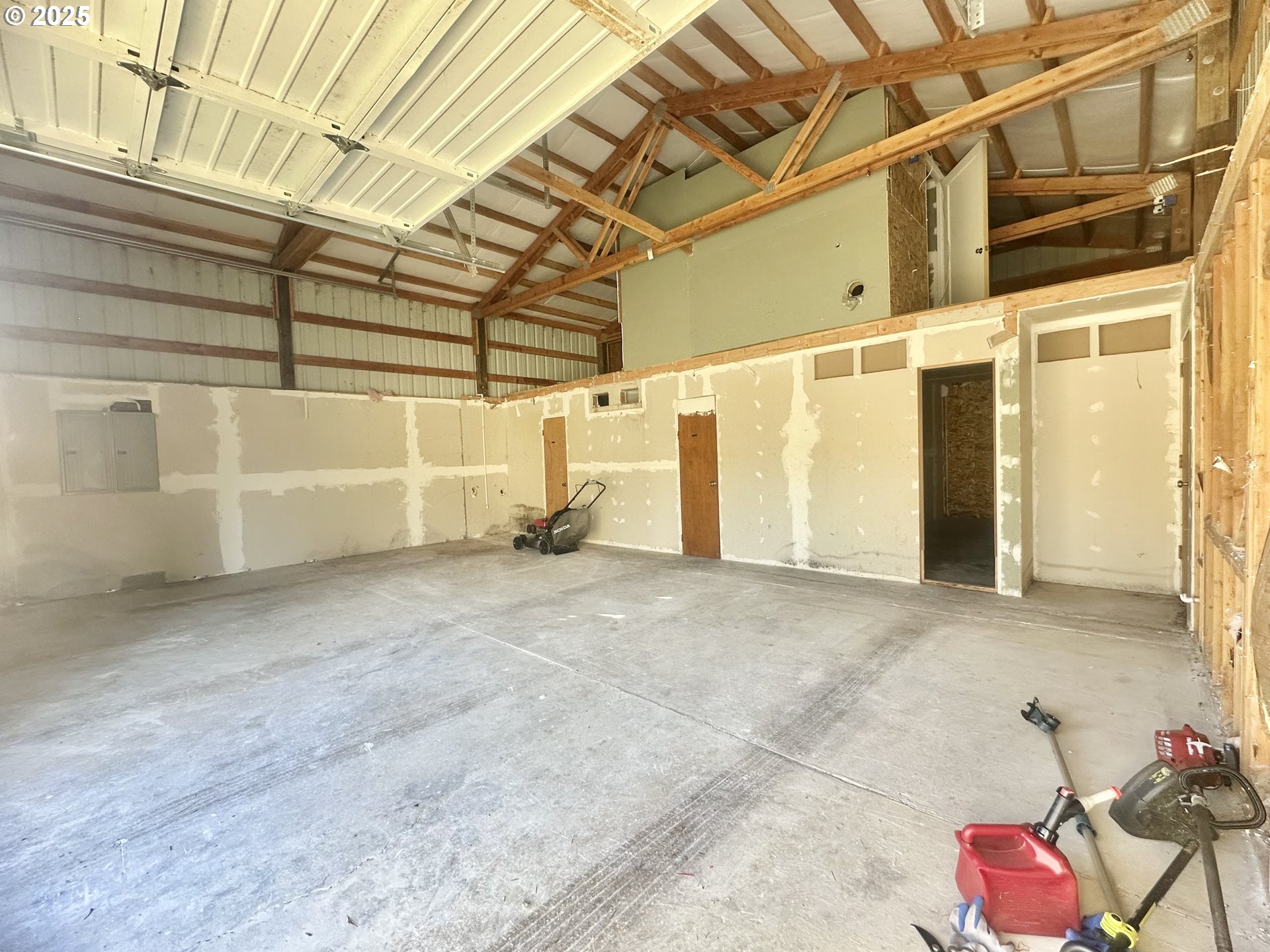 24275 Bunn Creek Road Cloverdale, OR 97112 - Photo 26 of 32 a view of a room with wooden walls